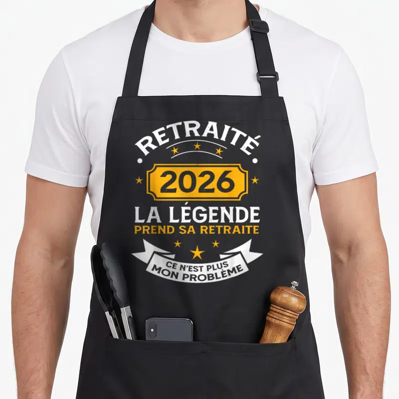 Tablier de cuisine noir avec inscription 2026 La Légende Prend Sa Retraite et ce n'est plus mon problème sur banderole blanche.