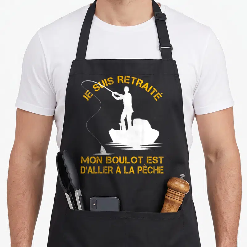 Tablier de cuisine noir avec silhouette blanche de pêcheur et texte jaune Je suis retraité.