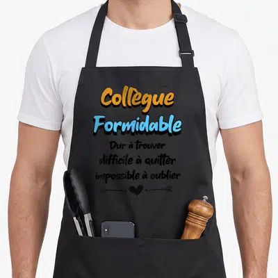 Tablier de cuisine noir avec texte orange et bleu Colleague Formidable Dur a trouver impossible a oublier et une flèche sur un coeur.