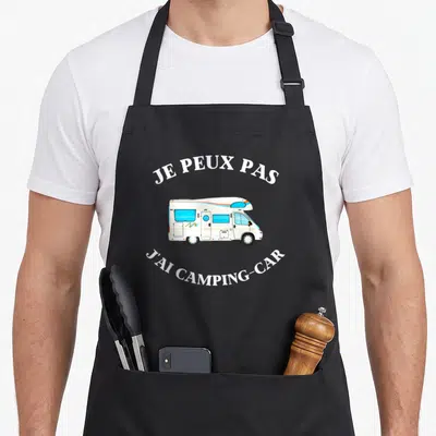 Tablier de cuisine noir avec illustration camping-car blanc et texte Je peux pas j'ai camping-car en blanc.