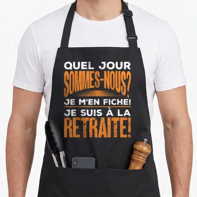 Tablier de cuisine noir avec texte blanc et orange Quel jour sommes-nous Je m'en fiche Je suis à la retraite