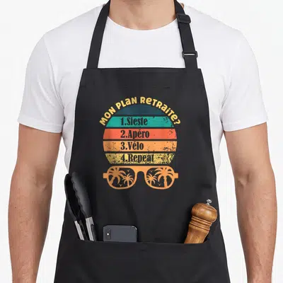 Tablier de cuisine noir avec motif retro listant sieste apéro vélo et repeat sous des lunettes de soleil palmées.