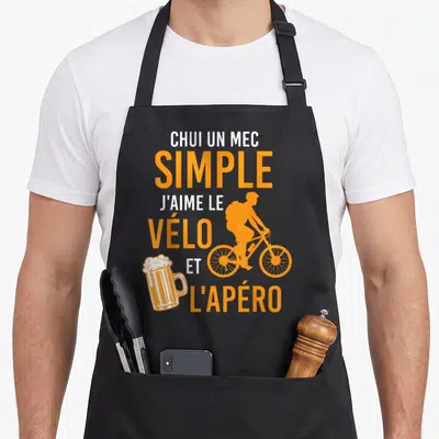 Tablier de cuisine noir avec texte blanc et orange illustrant un cycliste et une bière.