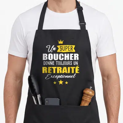 Tablier de cuisine noir avec texte blanc et jaune Un super boucher donne toujours un retraité exceptionnel surmonté d'une couronne.
