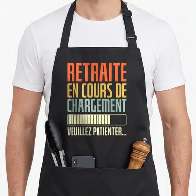 Tablier de cuisine noir avec inscription colorée Retraite en cours de chargement et barre de progression graphique.