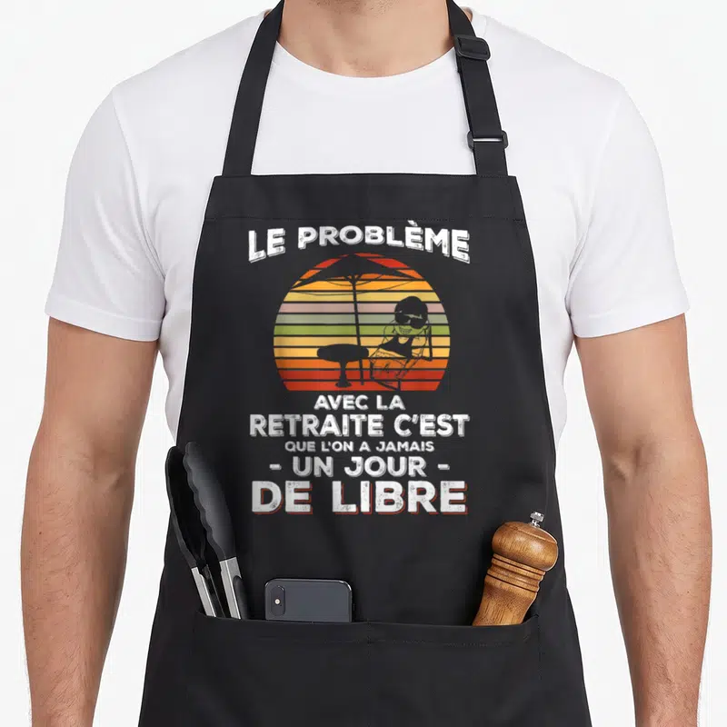 Tablier de cuisine noir avec illustration retro d'un soleil couchant et d'une personne au parasol.