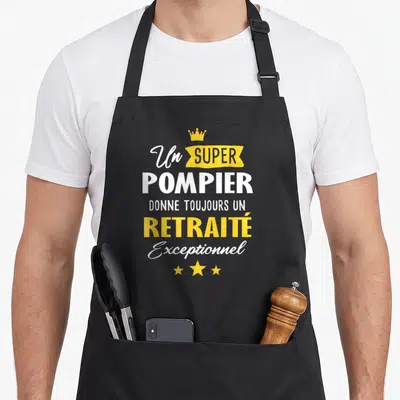 Tablier de cuisine noir avec texte blanc et jaune Un super pompier donne toujours un retraité exceptionnel surmonté d'une couronne et de trois étoiles.