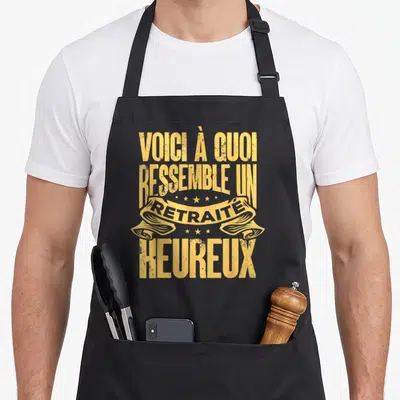 Tablier de cuisine noir avec inscription Voici à quoi ressemble un retraité heureux en typographie jaune vintage.