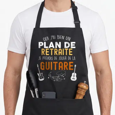 Tablier de cuisine noir avec inscription sur la retraite et illustration de guitares électriques et acoustiques blanches.