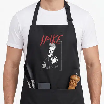 Tablier de cuisine noir avec illustration blanche de Spike et le mot SPIKE en lettres rouges au-dessus.