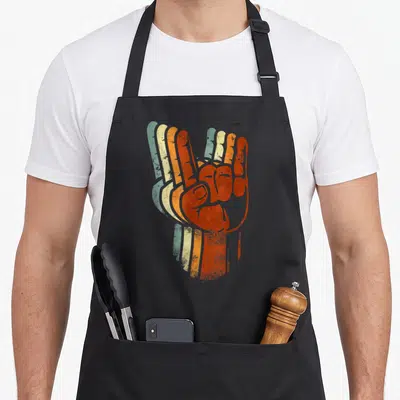 Tablier de cuisine noir avec illustration main rock cornes diable couleur orange et vert style vintage dégradé