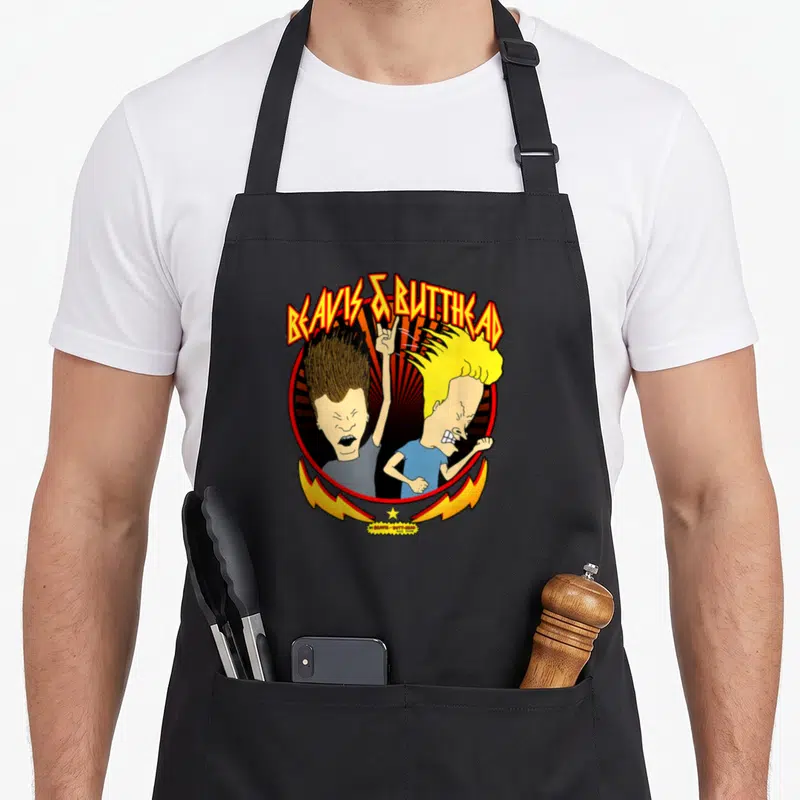 Tablier de cuisine noir avec Beavis and Butt-Head Metal Colors Rock Out et éclairs jaunes.