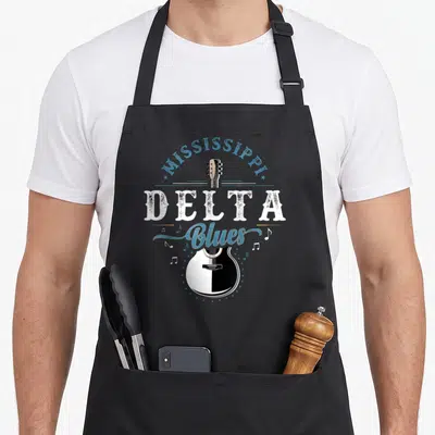 Tablier de cuisine noir avec illustration Mississippi Delta Blues et guitare acoustique bichrome.