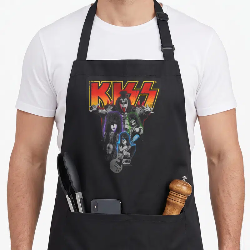 Tablier de cuisine noir avec le logo KISS et quatre musiciens en maquillages de monsters colorés.