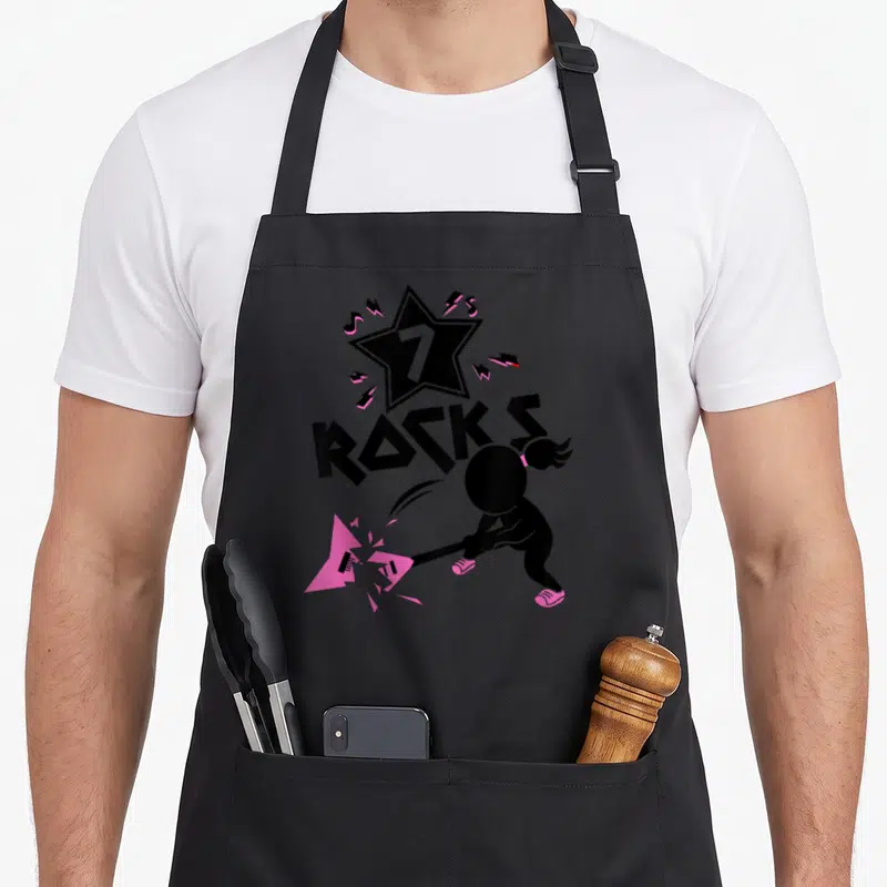 Tablier de cuisine noir avec silhouette brisant une guitare rose, étoile 7 et texte Rocks Punk.