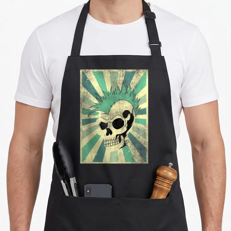 Tablier de cuisine noir avec un crâne punk à la coiffure vert mint sur fond rayé vintage