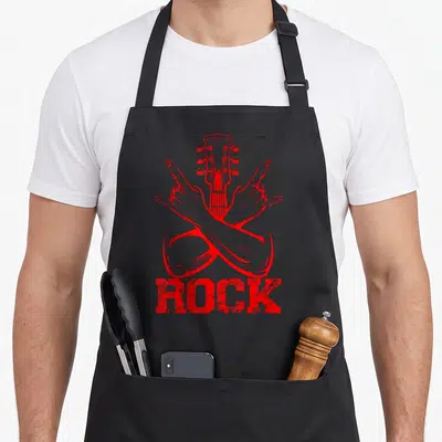 Tablier de cuisine noir avec illustration rouge de mains croisées en signe de rock et une tête de guitare au centre.