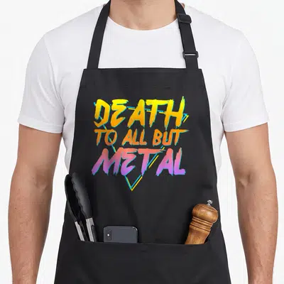 Tablier de cuisine noir avec inscription Death To All But Metal en lettres dégradées jaune orange et violet.