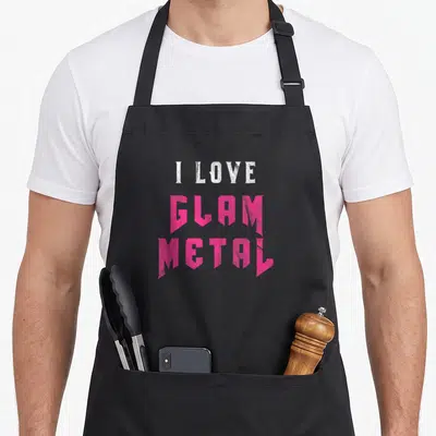 Tablier de cuisine noir avec l'inscription I Love Glam Metal en typographie rose et blanche style heavy metal.