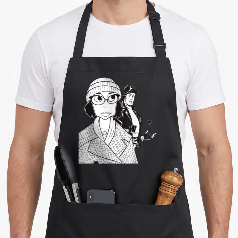 Tablier de cuisine noir avec illustration d'Adrian au bonnet et Rocky en arrière-plan en noir et blanc.