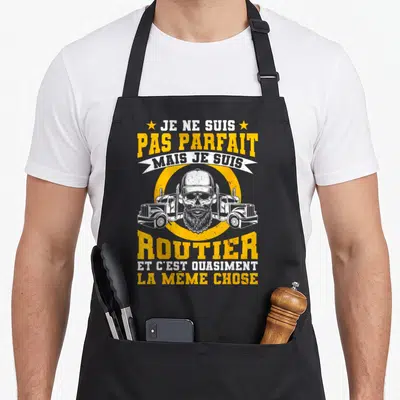 Tablier de cuisine noir avec illustration d'un crâne barbu entre deux camions et le texte Je ne suis pas parfait mais je suis routier