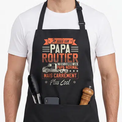 Tablier de cuisine noir avec inscription Je suis un papa routier et dessin de camion orange et blanc sur fond uni.