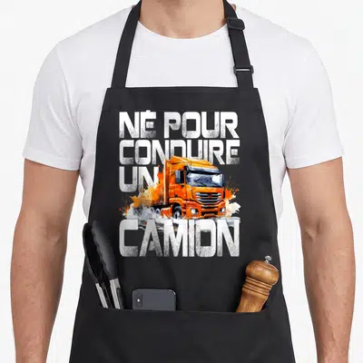 Tablier de cuisine noir avec illustration de camion orange et texte blanc né pour conduire un camion