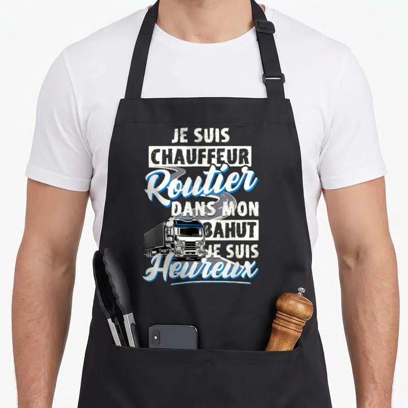 Tablier de cuisine noir avec illustration de camion et texte blanc souligné de bleu affirmant le bonheur du routier au volant.