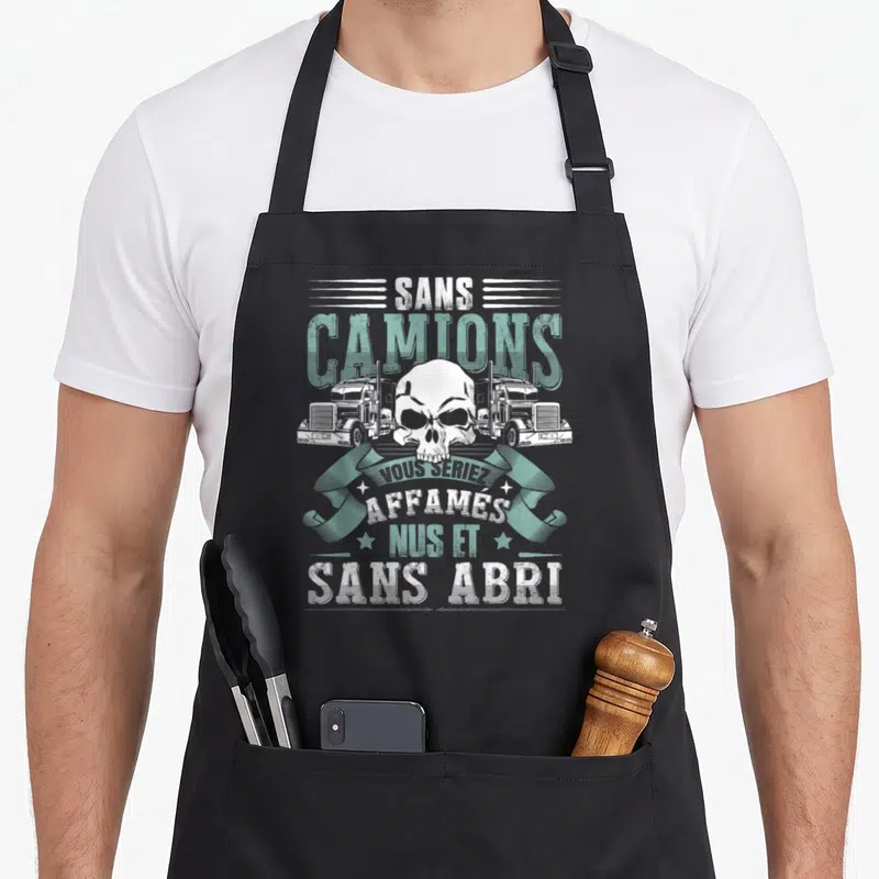 Tablier de cuisine noir avec un crâne blanc, deux camions verts et le texte sans camions vous seriez affamés nus et sans abri.