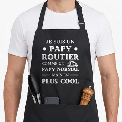 Tablier de cuisine noir avec l'inscription Je suis un papy routier comme un papy normal mais en plus cool et un semi-remorque blanc.