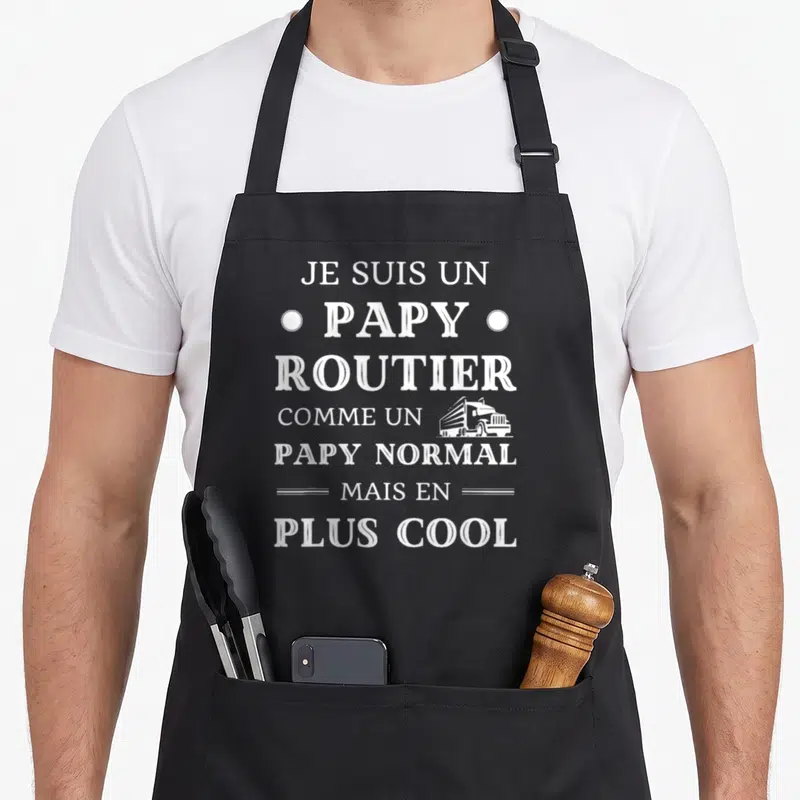 Tablier de cuisine noir avec l'inscription Je suis un papy routier comme un papy normal mais en plus cool et un semi-remorque blanc.