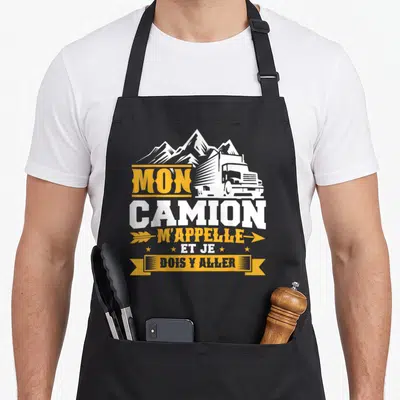 Tablier de cuisine noir avec illustration de truck blanc, montagnes et texte jaune Mon camion m'appelle et je dois y aller