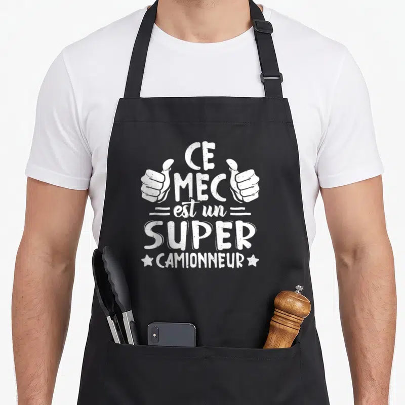 Tablier de cuisine noir avec l'inscription Ce mec est un super camionneur et deux pouces levés blancs.