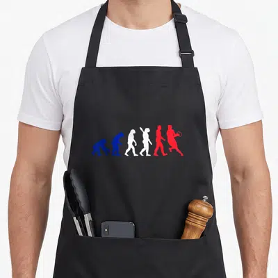 Tablier de cuisine noir avec silhouette évolutive d'un joueur de rugby tenant une raquette en rouge.