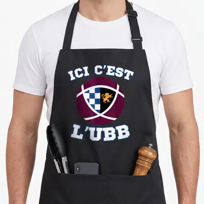 Tablier de cuisine noir avec le logo UBB Bordeaux et l'inscription Ici C'est L'UBB en lettres blanches.