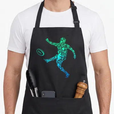 Tablier de cuisine noir avec une silhouette de joueur de rugby composée de petits dessins sportifs dans des tons bleu et vert menthe.