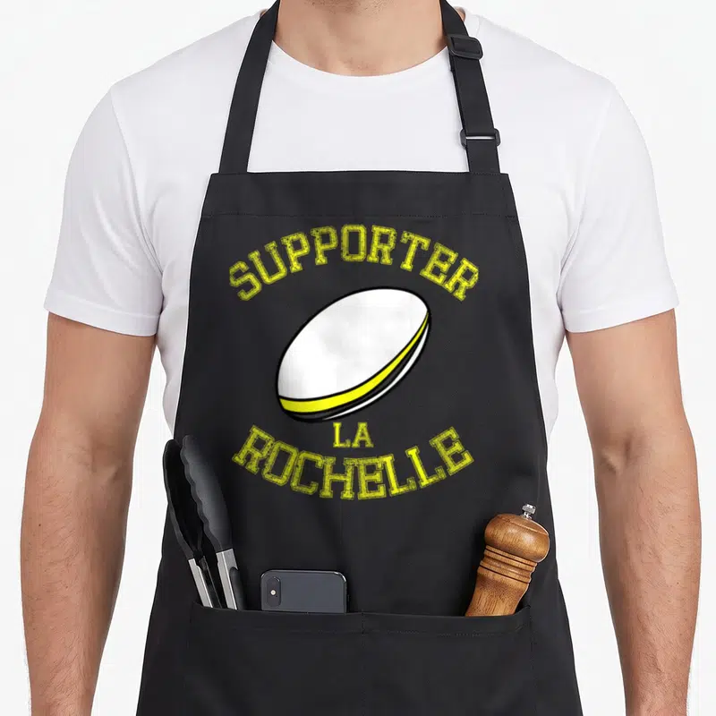 Tablier de cuisine noir avec illustration de ballon ovale blanc et texte jaune Supporter La Rochelle.