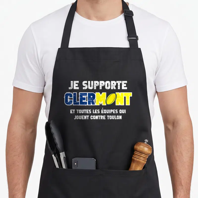 Tablier de cuisine noir avec le texte Je Supporte Clermont et un ballon de rugby jaune intégré au logo.