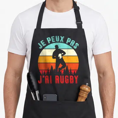 Tablier de cuisine noir avec illustration vintage d'un joueur de rugby et texte Je peux pas j'ai rugby.