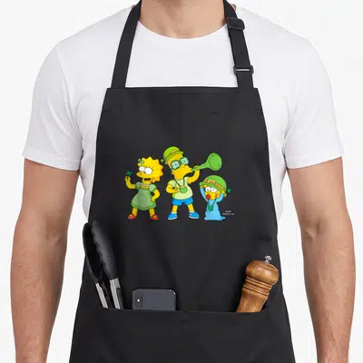 Tablier de cuisine noir avec Lisa, Bart et Maggie des Simpson en tenue verte pour la Saint Patrick.