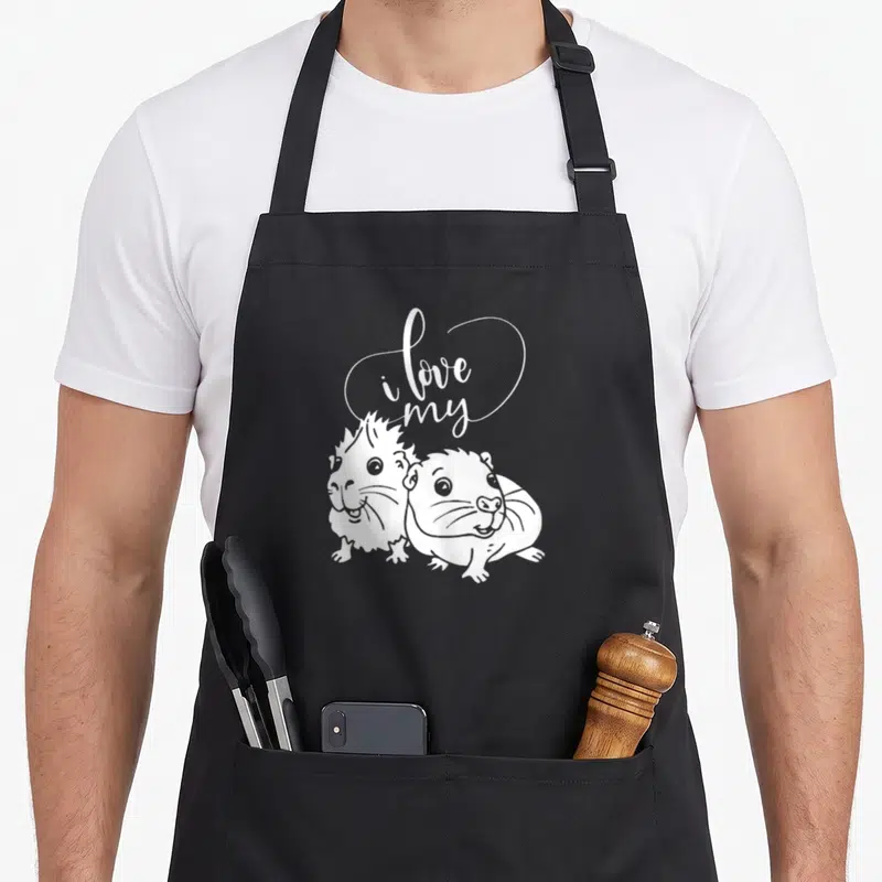 Tablier de cuisine noir avec illustration blanche de deux cochons d'Inde et texte i love my au-dessus.
