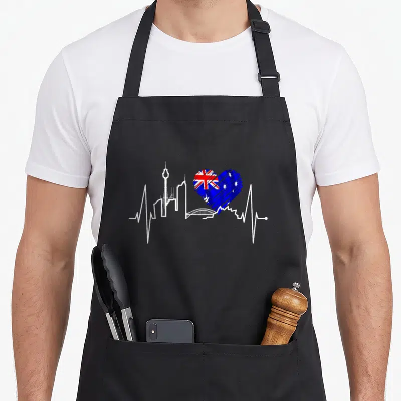 Tablier de cuisine noir avec skyline blanc, ligne cardiogramme et cœur au drapeau australien.