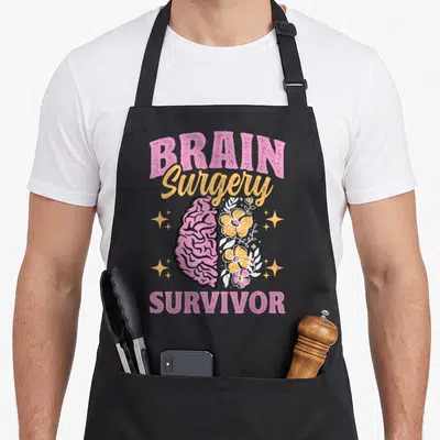 Tablier de cuisine noir avec illustration cerveau rose fleurs et texte Brain Surgery Survivor