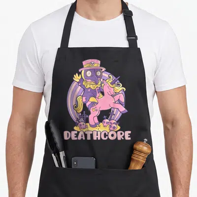 Tablier de cuisine noir avec illustration d'un docteur de la peste montant une licorne rose et le mot Deathcore en bas.
