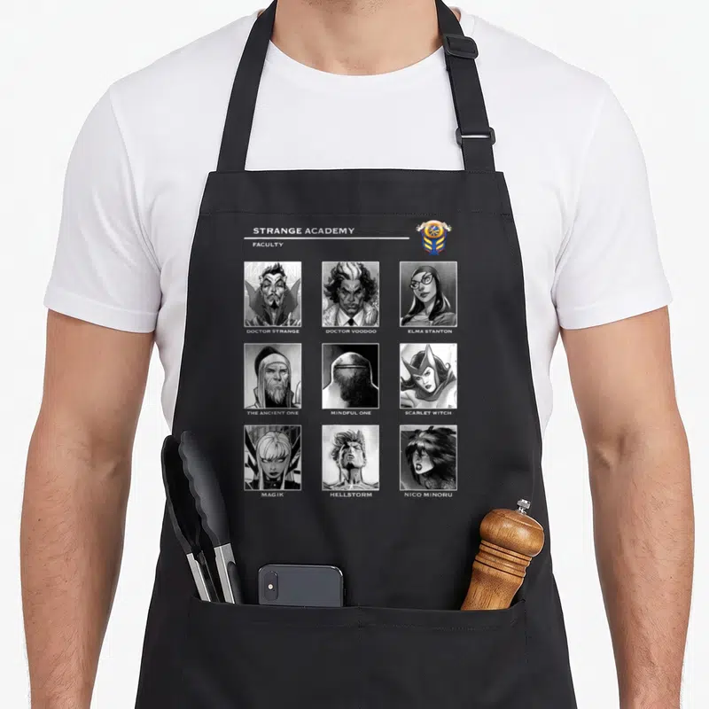 Tablier de cuisine noir avec portraits en noir et blanc de la faculty de Strange Academy incluant Doctor Strange et Scarlet Witch.