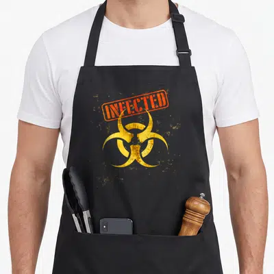Tablier de cuisine noir avec un logo de danger biologique jaune et une étiquette rouge portant le mot INFECTED.