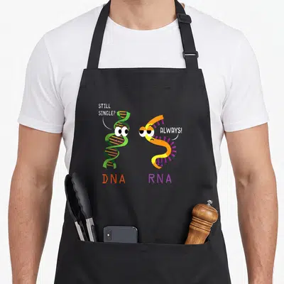 Tablier de cuisine noir avec ADN vert et ARN orange souriants affichant des bulles de dialogue humoristiques sur fond uni.