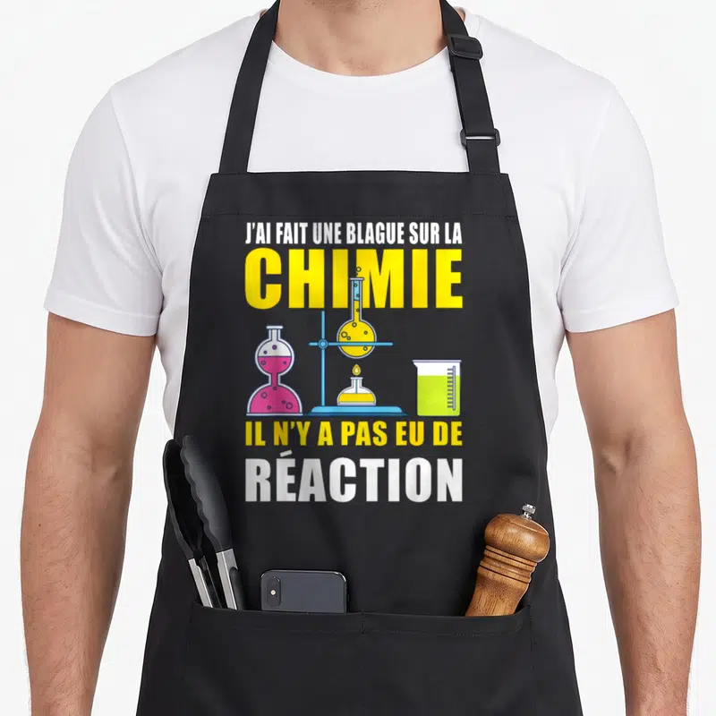 Tablier de cuisine noir avec inscription J'ai fait une blague sur la chimie et illustration de flacons d'expérience colorés.