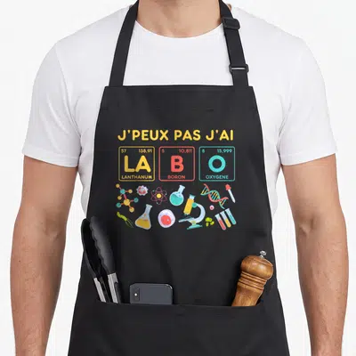 Tablier de cuisine noir avec inscription J'peux pas j'ai La Bo O et illustrations scientifiques colorées.