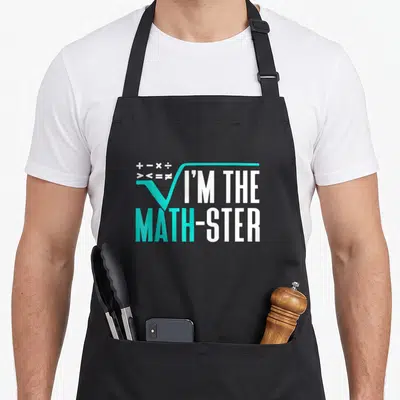 Tablier de cuisine noir avec inscription I'M THE MATH-STER et symboles mathématiques en turquoise et blanc.